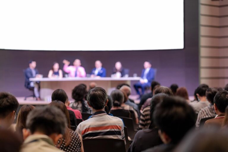 Panel discussion and keynote speaker setup at a conference